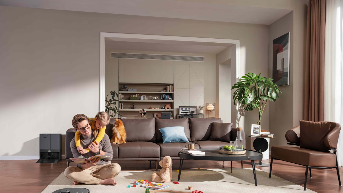 man with eufy x10 Pro Omni robot vacuum cleaner