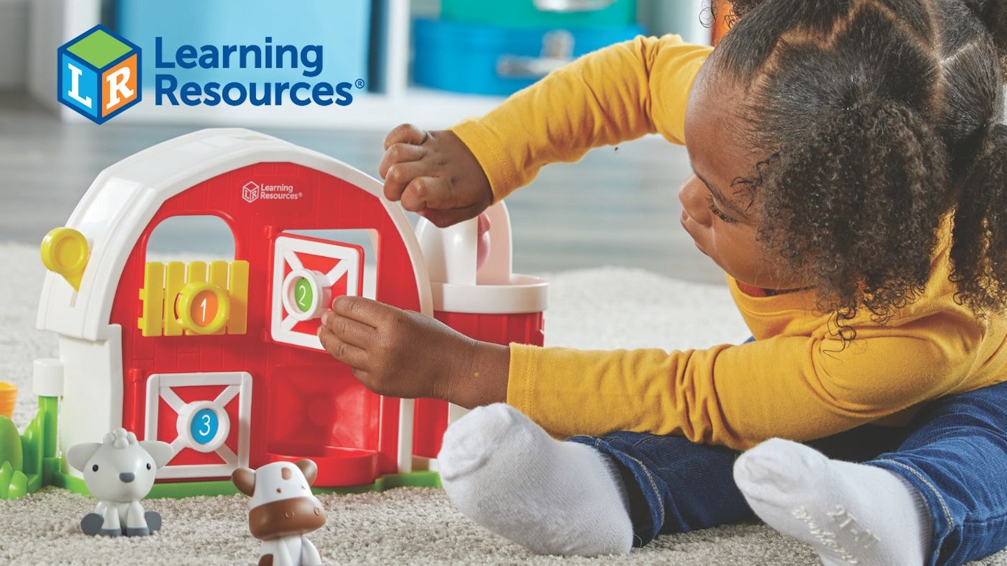 Child playing with Learning Resources toy